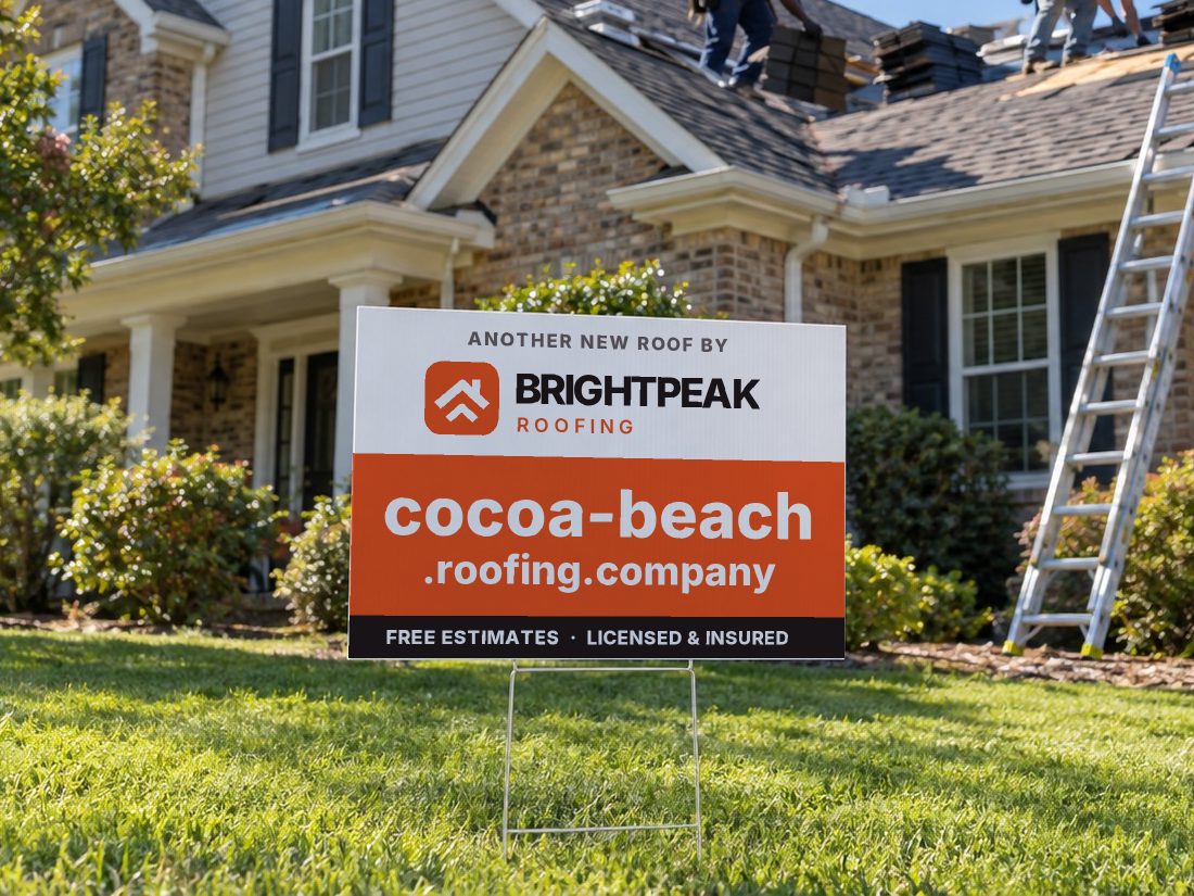 cocoa-beach.roofing.company on a yard sign in front of a house getting a new roof